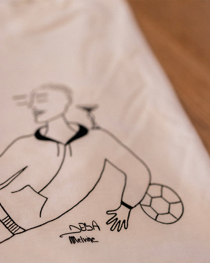 T-Shirt « Jongler entre les mondes » par Melvine Deba